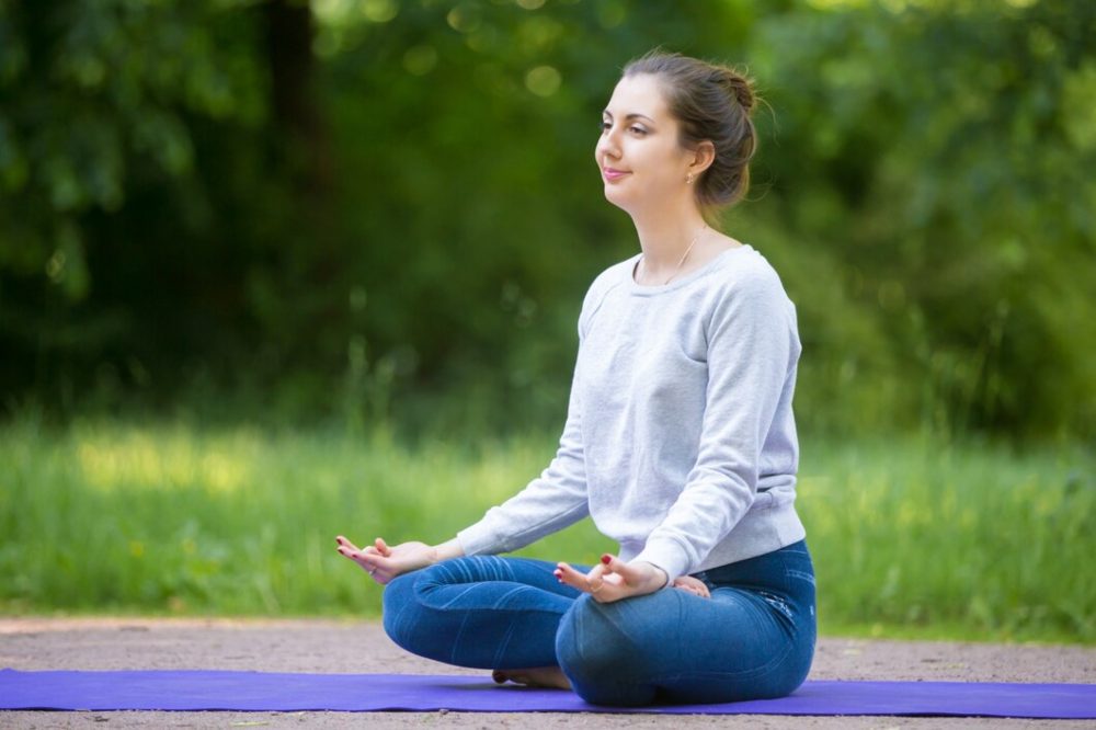 women in sukhasana pose