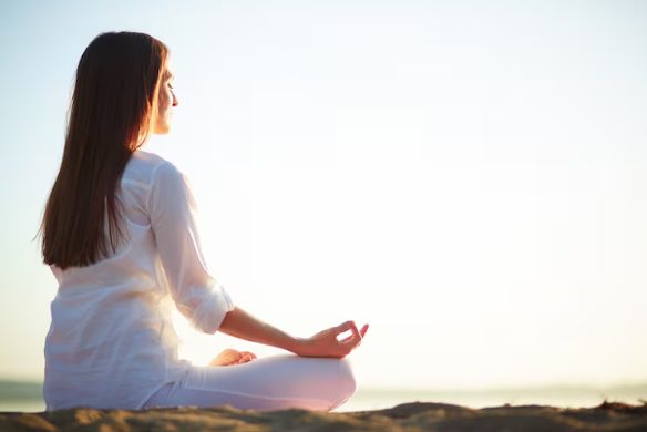women performing meditation