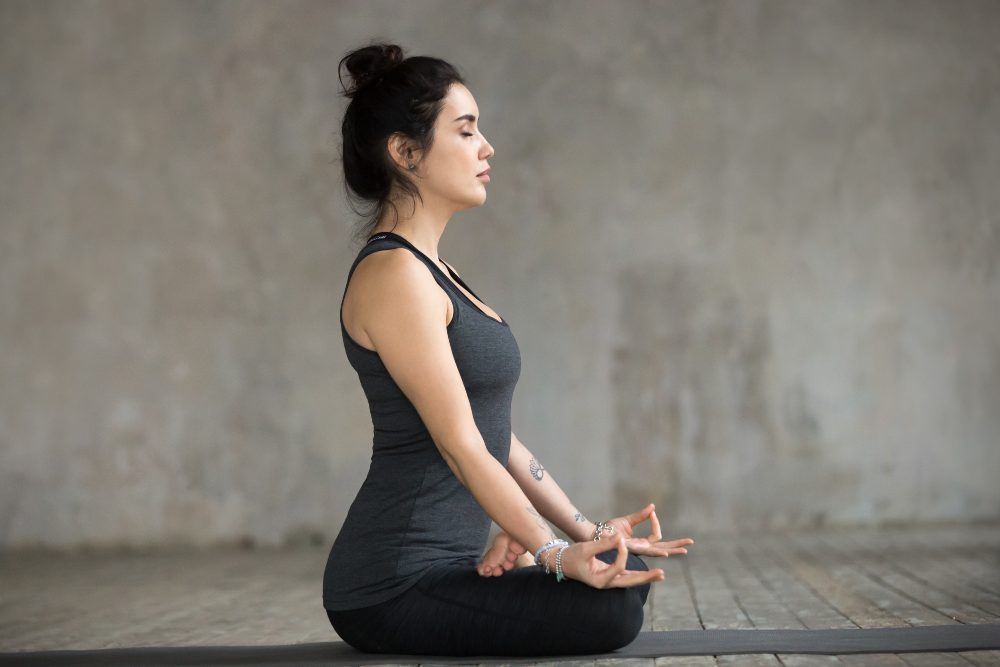 yoga practitioner performing sukhasana