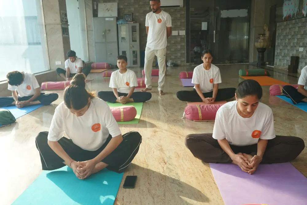 students performing yoga asanas during yoga ttc