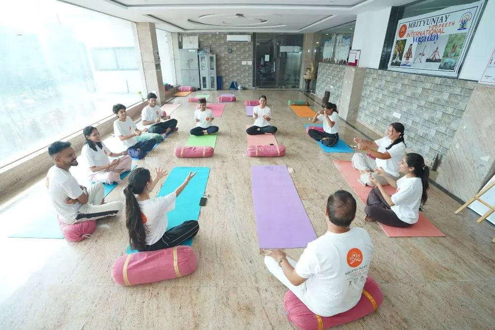 students performing yoga poses at mrityunjay yogpeeth rishikesh