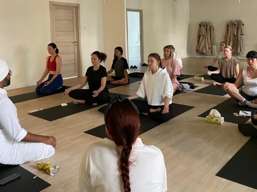 students practicing meditation during yoga training in rishikesh students practicing meditation during yoga training in rishikesh