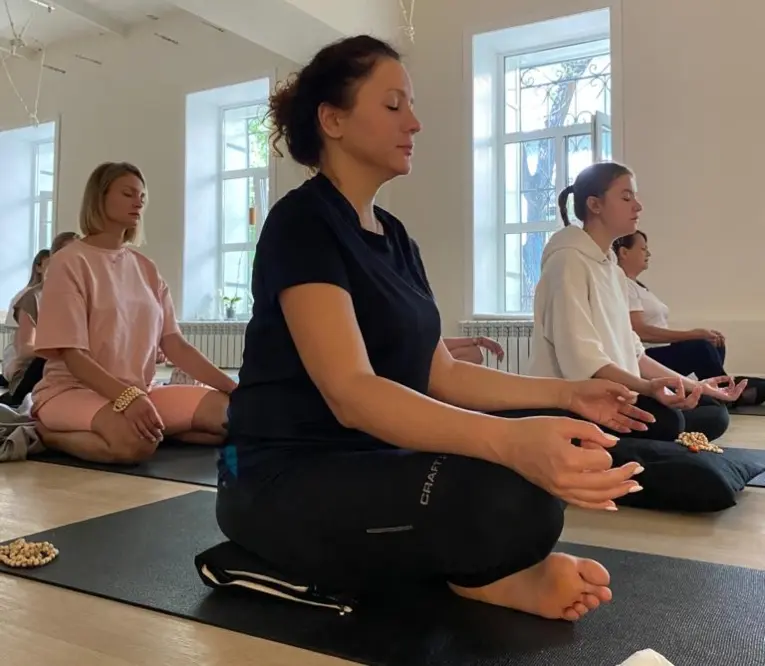 students practicing sukhasana during a yoga meditation session at mrityunjay yogpeeth students practicing sukhasana during a yoga meditation session at mrityunjay yogpeeth