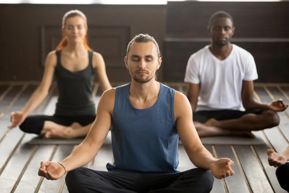 sukhasana meditation practice in a yoga class sukhasana meditation practice in a yoga class