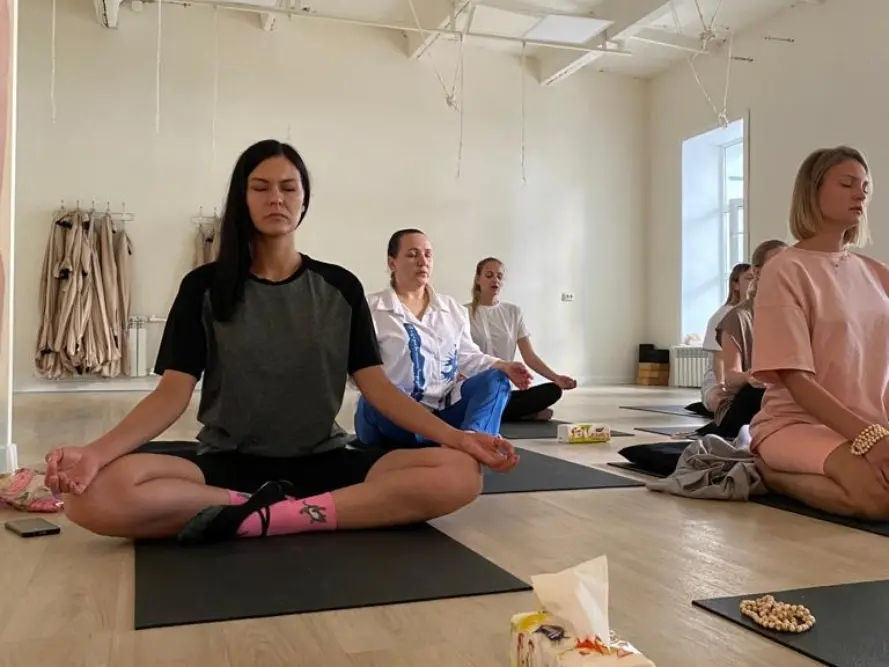 yoga students practising meditation during a yoga teacher training