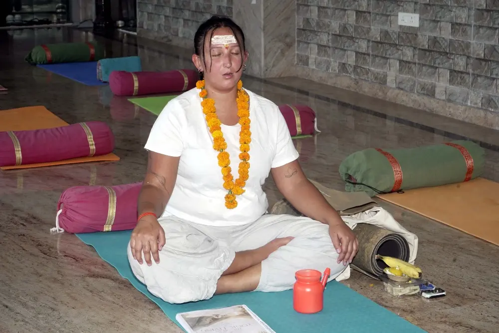 yoga practitioner practicing seated meditation during yoga teacher training at mrityunjay yogpeeth yoga practitioner practicing seated meditation during yoga teacher training at mrityunjay yogpeeth