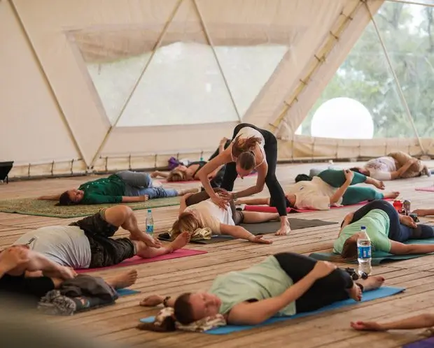 200 hour yoga teacher training students practicing yoga poses