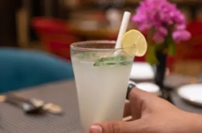 Refreshing Ayurvedic herbal welcome drink with lemon served at a wellness retreat in India