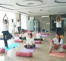 Yoga teacher training students practising together